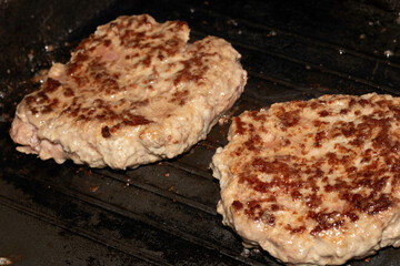 Close up of home made beef burger being griddle fried