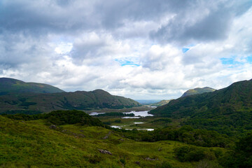 mountain landscape with lake and clouds