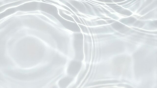 Subtle water surface with bright sunlight reflecting and refracting creating soft caustics pattern perfect for backgrounds