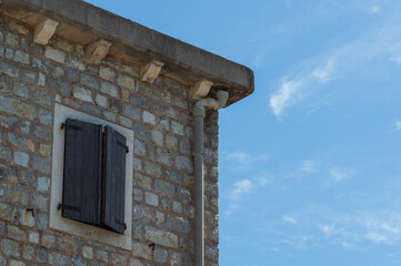 Old stone houses in Petrovac Montenegro, a resort town located on the coast of the Adriatic Sea in Montenegro