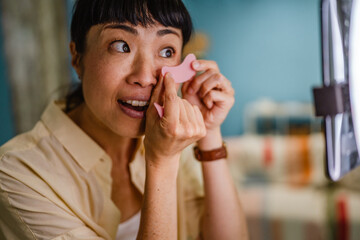 Japanese woman live streaming to review makeup and cosmetic products