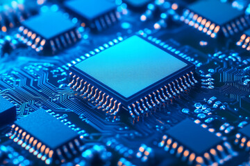 Close up shot of a blue computer chip with visible circuit board design