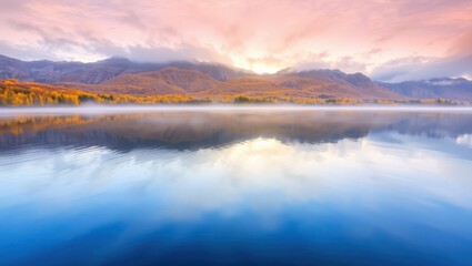 Fototapeta premium Serene Mountain Lake Reflecting Golden Autumn Foliage and Pastel Sky at Dawn