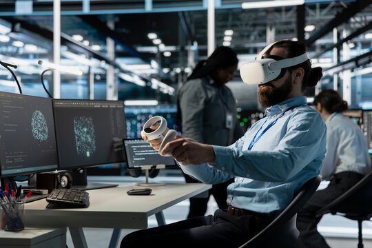 Software developer using VR headset tech to oversee server cabinets doing data intensive operations. IT specialist using virtual reality equipment to supervise supercomputers