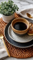 A top-down view of a beautifully arranged coffee cup with a pastry
