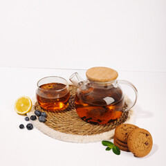 Tea composition still life of black tea, biscuits, lemon, English breakfast, tea party, promotional photo of tea