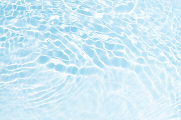 Blue water with ripples on the surface. Defocus blurred transparent blue colored clear calm water...