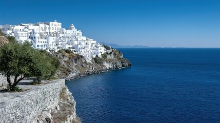 Picturesque white village perched on a Mediterranean cliff.