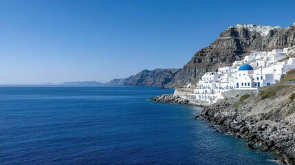 Picturesque coastal village nestled against a dramatic hillside.