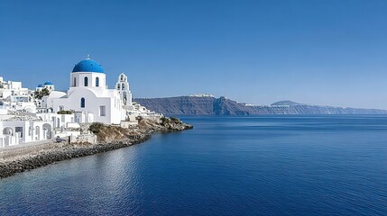 Mediterranean coastal scenery with white buildings and a calm sea.