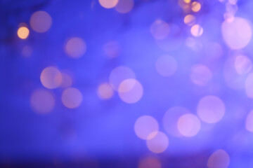  Lights Bokeh Background with Purple Hues. misty background with pink bokeh.Lights of garlands on a blue background.Pastel wallpaper in soft blue and pink tones.Christmas Festive Wallpaper.