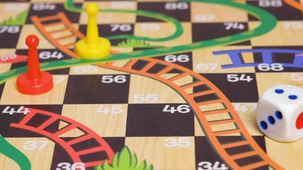 Slow motion video of a hand rolling a dice on a board game. Board game with friends concept - Powered by Adobe