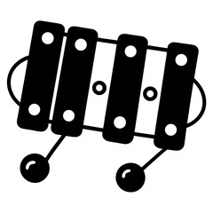 Simple black and white xylograph of a toy xylophone