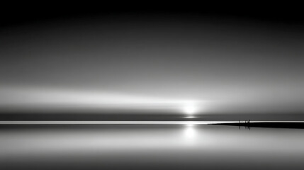 A black and white photo of a beach with a sunset in the background