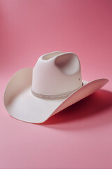 A White Cowboy Hat on a Pink Background, Feminine Country Style