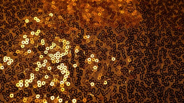 Golden sequins texture.Festive Wallpaper with copy space. New Year and Christmas Festive background. 4k footage