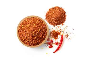 Red chili pepper in wooden bowl  with red pepper flakes isolated on white background. Top view