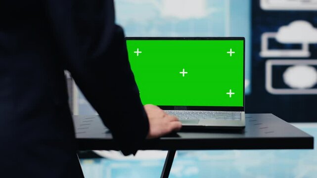 General director with a chroma key display reviewing performance metrics, finance graphs and strategy tools to guide a new investment and decision making. Long term business growth. Camera A.