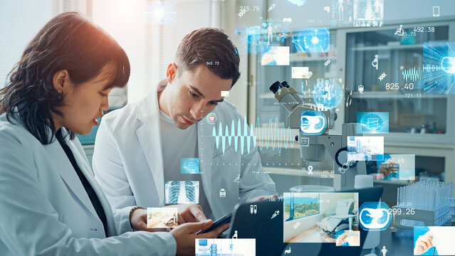 Multinational group of scientists conducting an experiment and medical technology concept