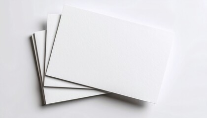 Minimalist blank paper sheets on a white background representing space for creativity or communication