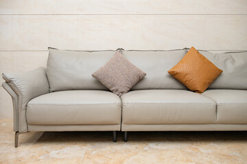 gray comfortable and stylish sofa with cushions at horizontal composition