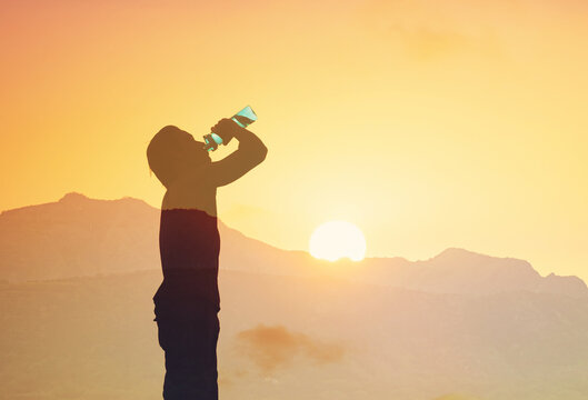 Active man drinking water staying hydrated
