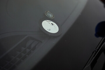 Windshield Chip Before Repair. Visible spider cracks in the windshield are highlighted with a...