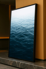 Vertical frame with a photograph of ocean waves in shades of blue and white, in a smooth transition from dark to light. The image evokes the immensity of the sea and the serenity of nature. Ideal for 