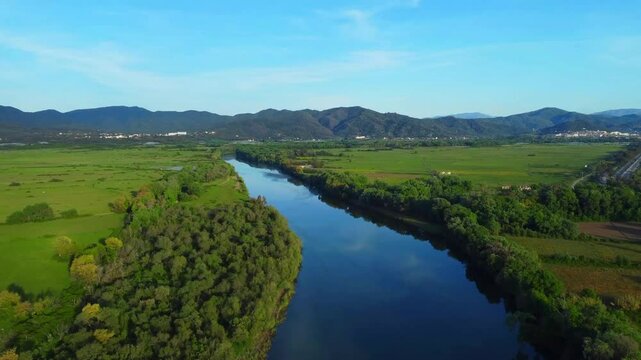 Aerial View of river, Beautiful Aerial View of African Jungles forest and River, Landscape in aerial drone shot. Adove calm tranquil river in Jijel Algeria North Africa, River and green forest trees.