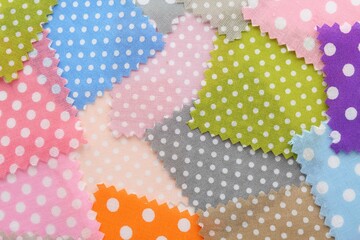 Samples of different fabrics as background, top view