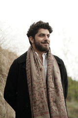 A Kashmiri model dressed in a traditional shawl and vintage-style pheran, posing for a Kaar Kash...