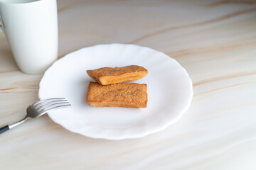 Financier and White Mug on Plate①