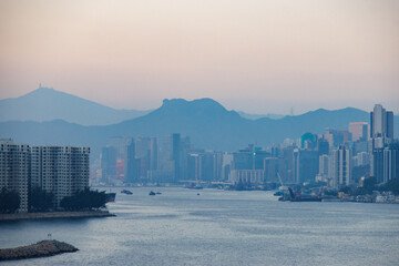 Misty Hong Kong Skyline and Harbour with Majestic Lion Rock