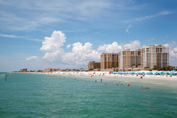 Crowd of people enjoying the sand beach in Clearwater beach, Florida, United States.
