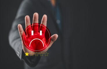 Customer hand showing 1-star rating with sad face emoji, representing negative feedback, poor service, bad review, dissatisfaction, and low customer experience in business.