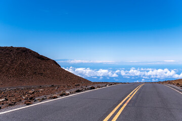Road to the sky with clouds and blue sky on the island of Maui.