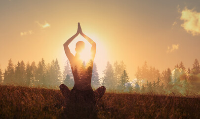 Meditate. Woman meditating in nature forrest at sunrise for inner peace
