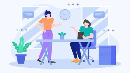Two women sitting at a desk in an office. Suitable for illustrating teamwork, collaboration, business meetings, diversity in workplace.