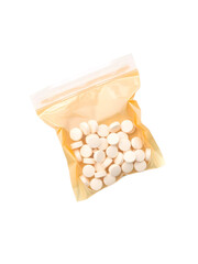 A brown plastic bag containing medicine from a hospital with white pills inside. On an isolated transparent background,