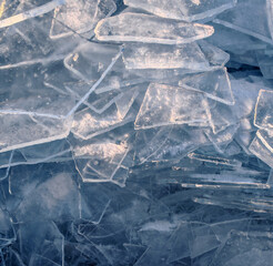 Endless hummock field on frozen Lake Baikal. Piles of snow-covered debris of blue ice on frosty day