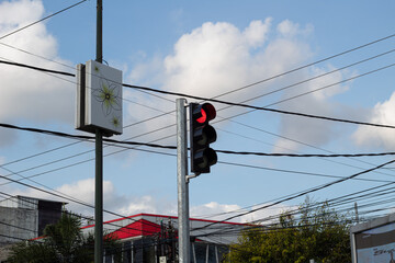 Red Traffic Light Against Blue Sky