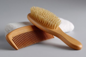 Wooden comb placed neatly with hairbrush
