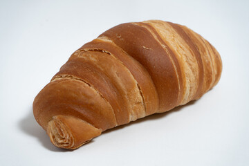Perfectly baked croissant isolated with natural lighting