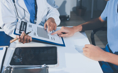 Young brunette woman having consultation at doctor office during