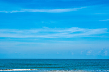 Nature of the ocean and blue sky Summer with sunshine, sandy beaches, clear blue waters sparkling against the blue sky. on an island with good ecology and environment Background for summer vacation