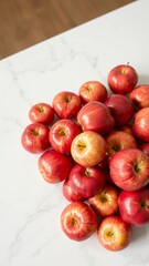 Vibrant Apples Display on Marble Countertop