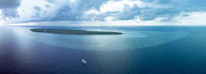 Seen from a bird's eye view, a picturesque island is found far off the southeast coast of Sulawesi, Indonesia. This area
is known for its extraordinary marine biodiversity.