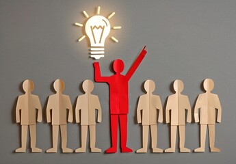 An image of a red paper figure as a leader holding up a lightbulb, a commercial concept diagram, used for the concepts of startup conferences and community activities.