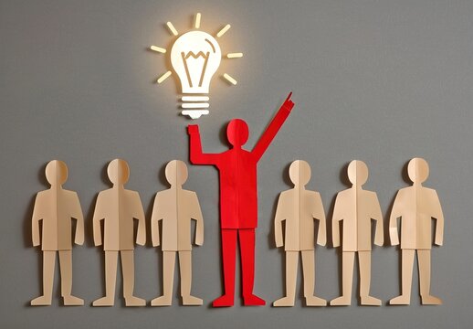 An image of a red paper figure as a leader holding up a lightbulb, a commercial concept diagram, used for the concepts of startup conferences and community activities.