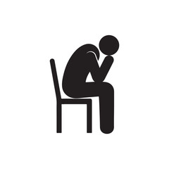 A person sitting on a chair looking depressed and sad